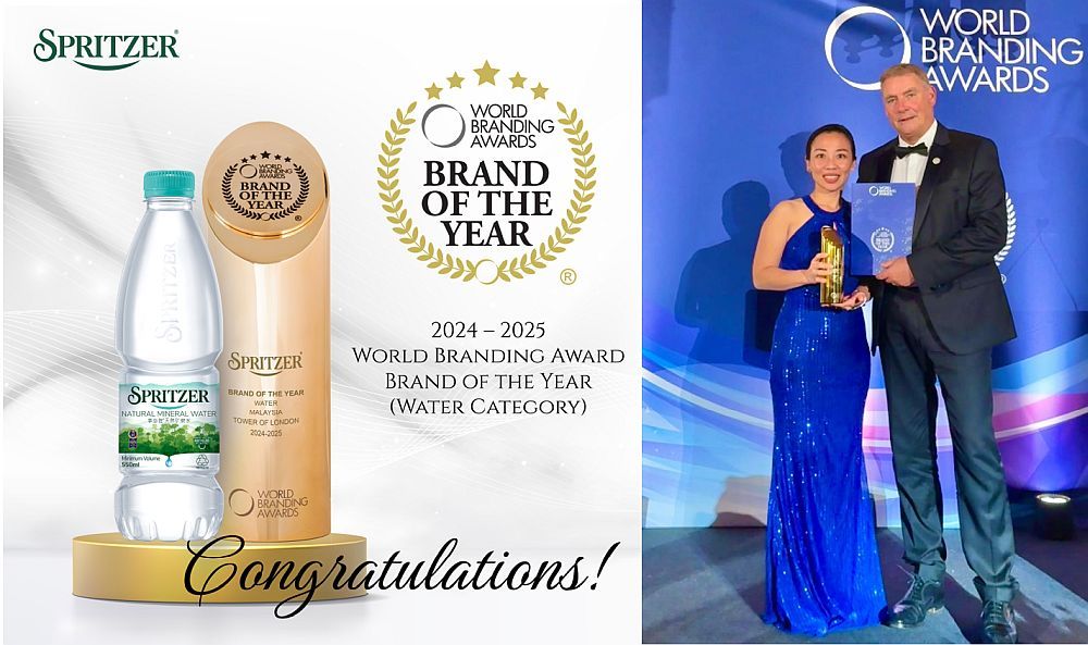 Spritzer's Head of Public Relations, Winnie Chin, accepting the Brand of the Year award under the national beverage division's Water Category during the recent World Branding Awards at the Tower of London